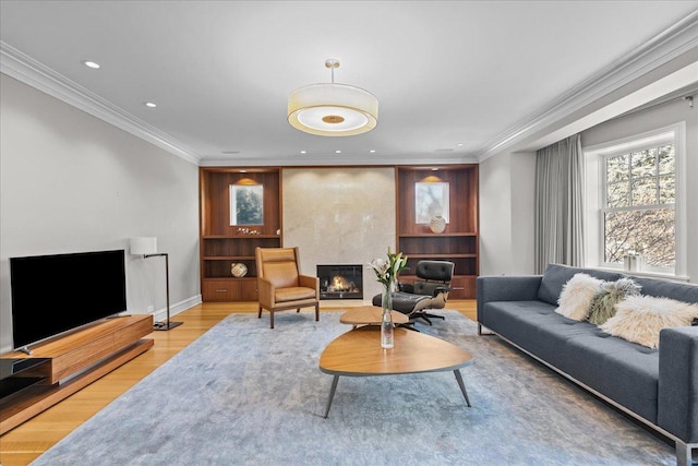 living room featuring hardwood / wood-style flooring and ornamental molding