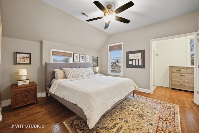 bedroom with ceiling fan, dark hardwood / wood-style flooring, and vaulted ceiling