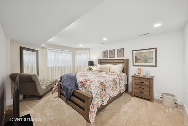 bedroom featuring light colored carpet