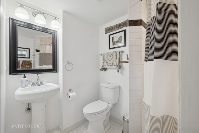 bathroom with toilet and sink