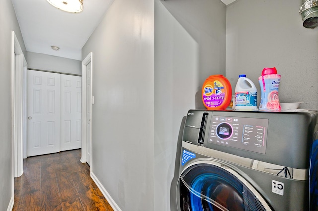 washroom featuring washer / clothes dryer and dark hardwood / wood-style flooring