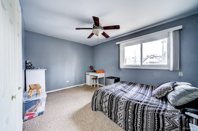 carpeted bedroom featuring ceiling fan