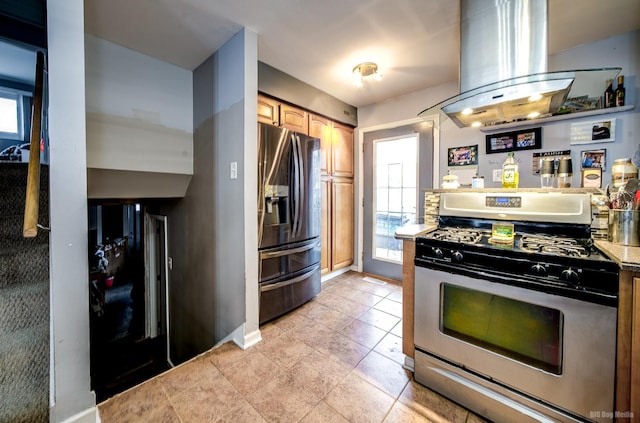 kitchen with island exhaust hood, stainless steel appliances, and stone countertops