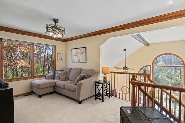 carpeted living room with ceiling fan, crown molding, and vaulted ceiling with beams