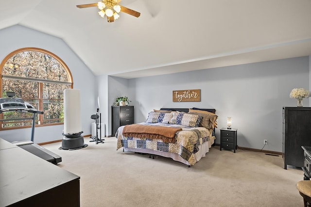 carpeted bedroom featuring ceiling fan and vaulted ceiling