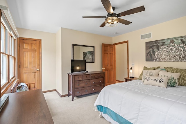 bedroom featuring ceiling fan and light colored carpet