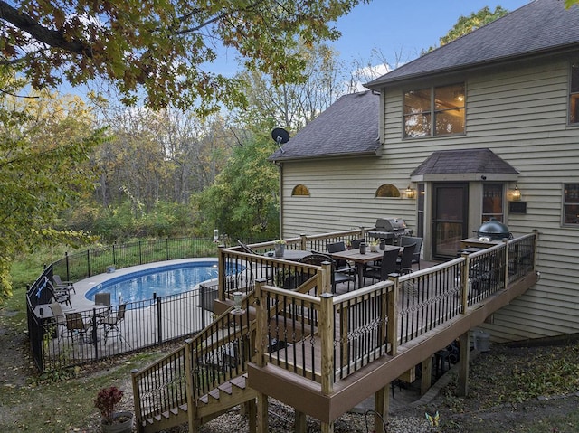 exterior space with a grill and a deck