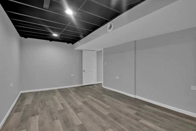 basement featuring wood-type flooring