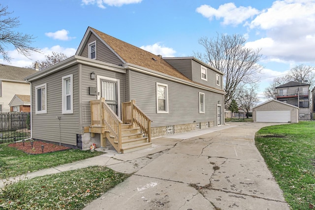 view of front of house featuring an outdoor structure and a garage