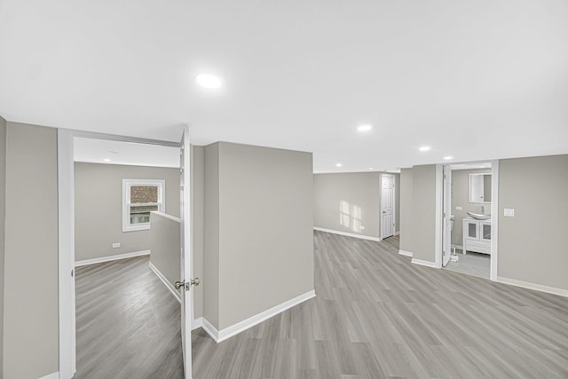 basement featuring light hardwood / wood-style floors