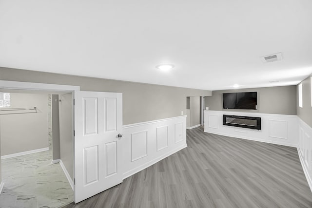 basement with light wood-type flooring