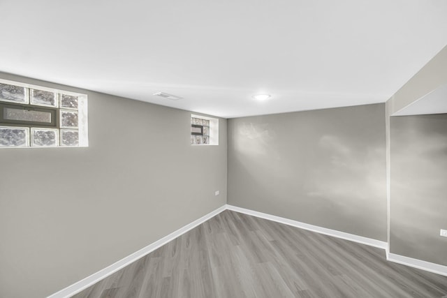 basement with wood-type flooring