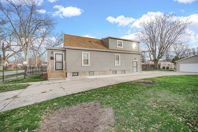 rear view of property featuring a yard