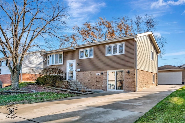 view of front of property with an outdoor structure and a garage