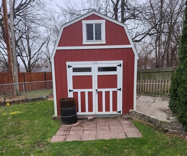 view of outbuilding with a yard