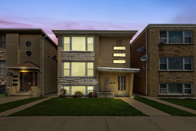 view of front of house with a yard