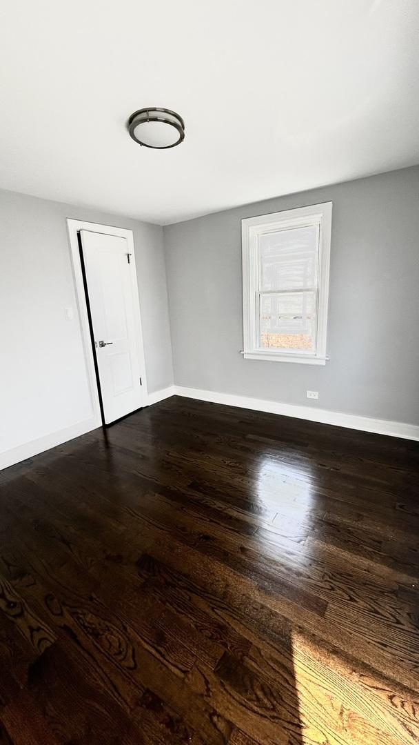 empty room featuring dark hardwood / wood-style floors