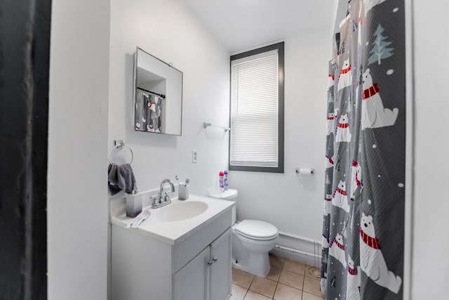 bathroom featuring tile patterned flooring, vanity, and toilet