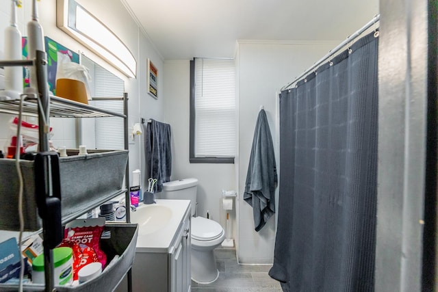 bathroom featuring walk in shower, toilet, vanity, and ornamental molding