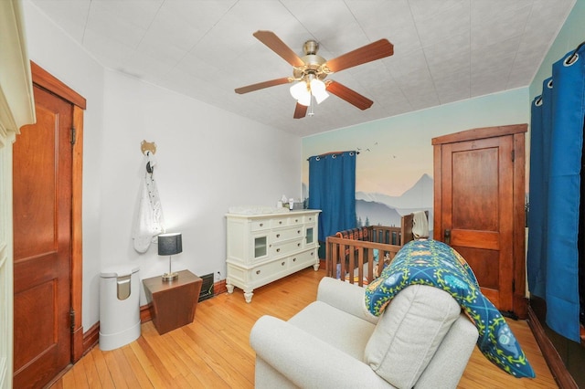 bedroom featuring ceiling fan and light hardwood / wood-style floors