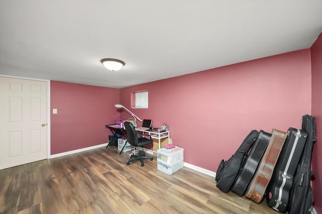 home office with wood-type flooring