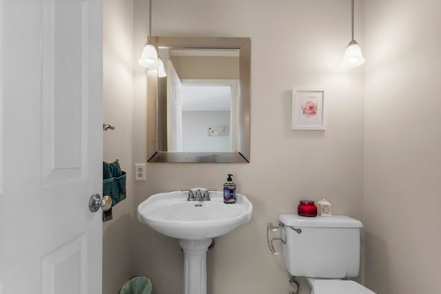 bathroom featuring sink and toilet