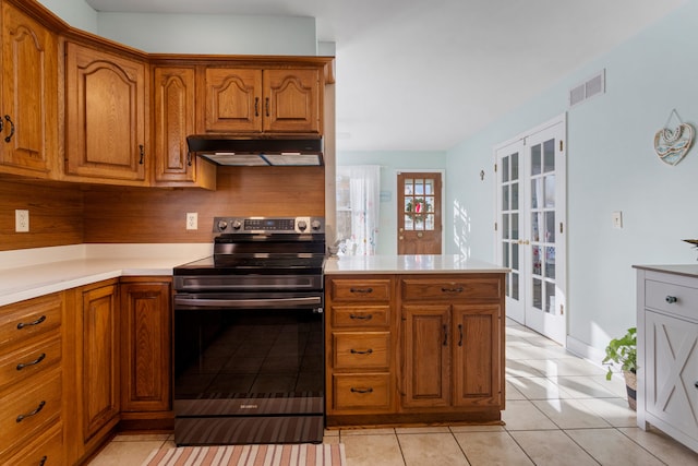 kitchen featuring french doors, decorative backsplash, kitchen peninsula, light tile patterned flooring, and electric range