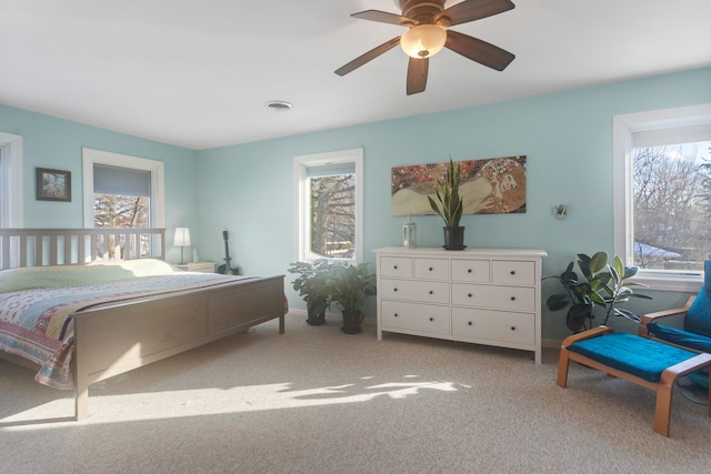 carpeted bedroom with ceiling fan