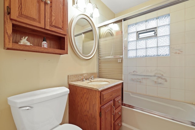 full bathroom with vanity, toilet, and tiled shower / bath