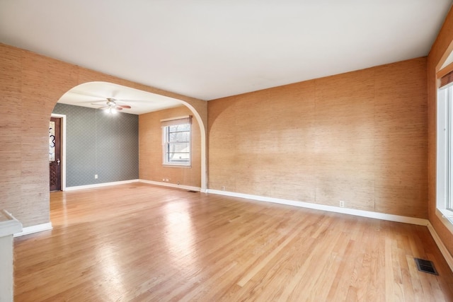 unfurnished room featuring ceiling fan and light hardwood / wood-style floors