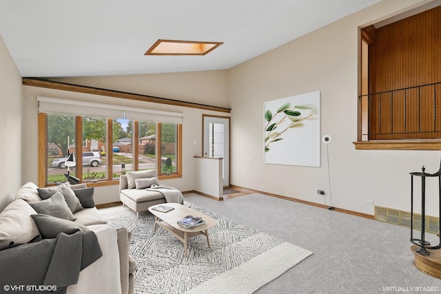 living room with carpet floors and lofted ceiling with skylight