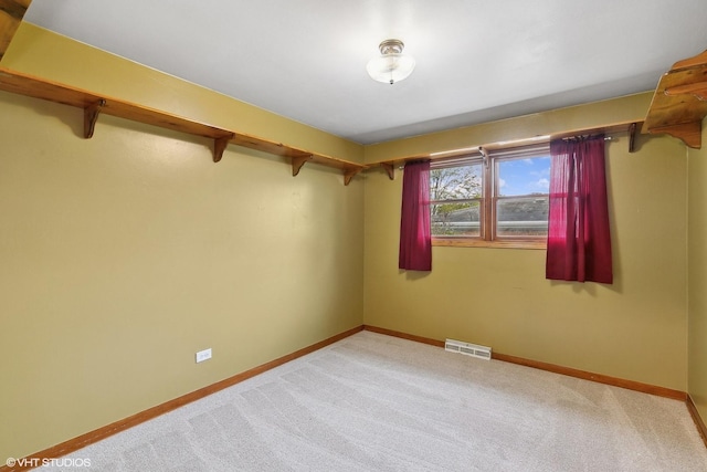 empty room with light colored carpet