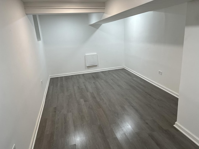 basement with dark wood-type flooring