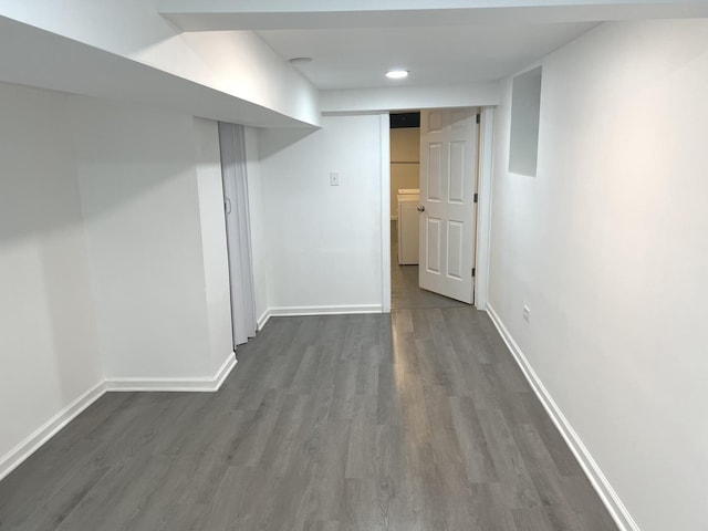 basement with dark wood-type flooring