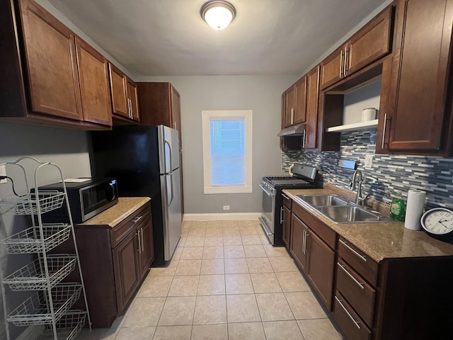 kitchen featuring sink, light tile patterned floors, stainless steel appliances, and tasteful backsplash