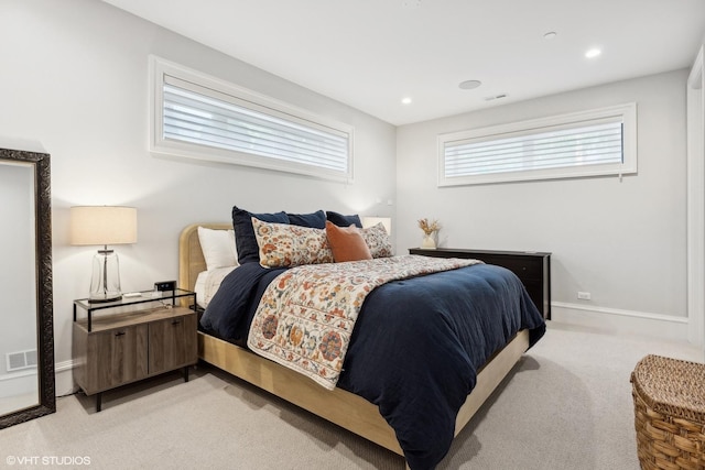 bedroom featuring light colored carpet