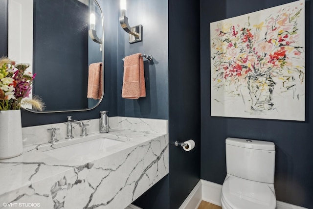 bathroom with sink and toilet