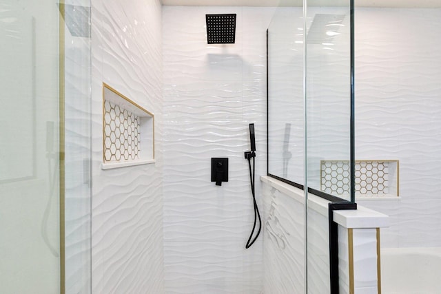 interior details with a tile shower