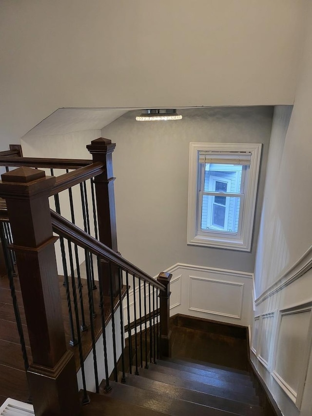 stairs featuring hardwood / wood-style flooring