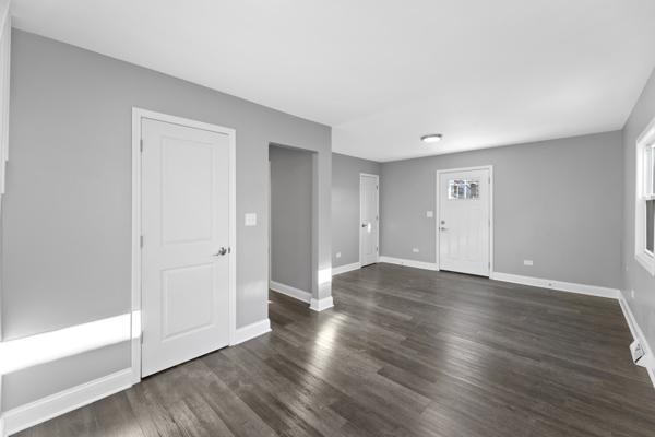 unfurnished room featuring dark hardwood / wood-style flooring