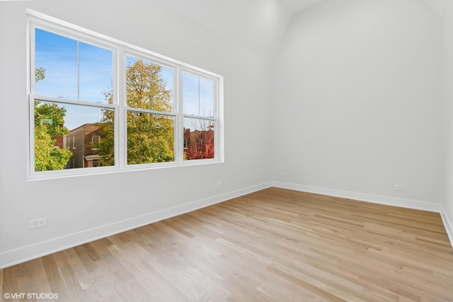 spare room with light hardwood / wood-style flooring