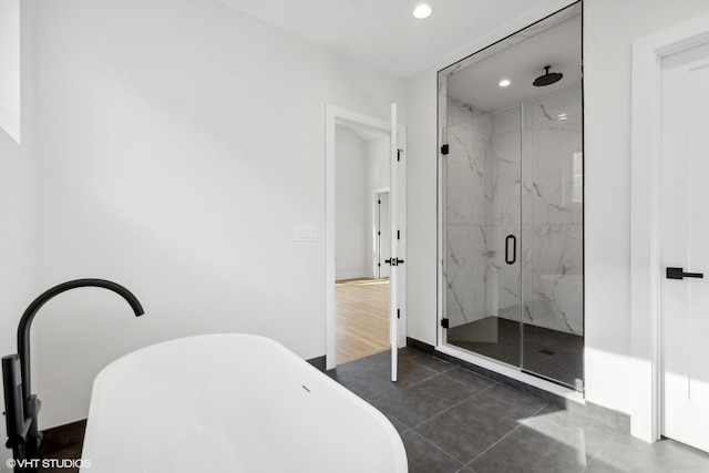 bathroom with plus walk in shower and tile patterned floors