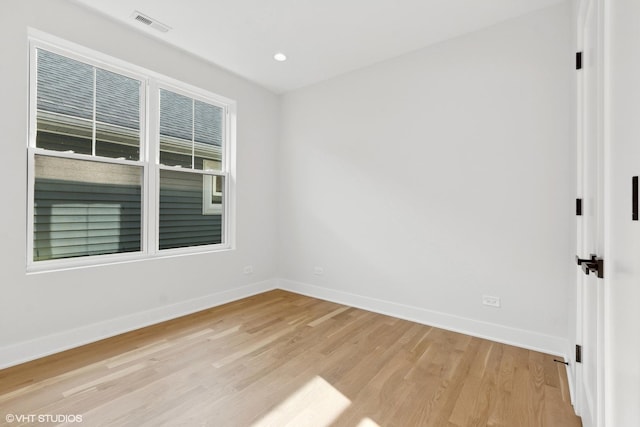 unfurnished room featuring light wood-type flooring