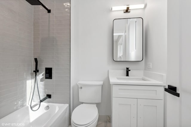 full bathroom with tiled shower / bath combo, toilet, and vanity