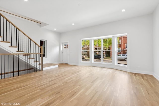 unfurnished living room with light hardwood / wood-style flooring