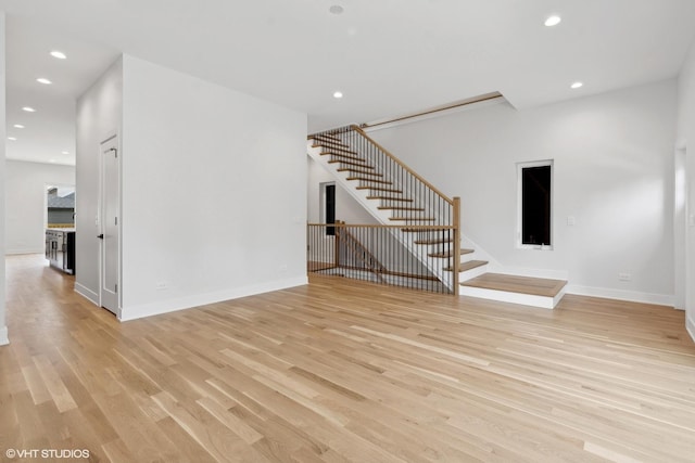 unfurnished living room with light wood-type flooring