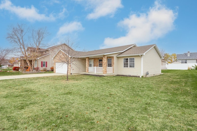 ranch-style house featuring a porch, a front yard, and a garage