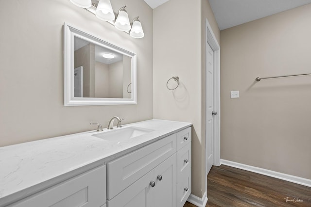 bathroom featuring vanity and hardwood / wood-style flooring