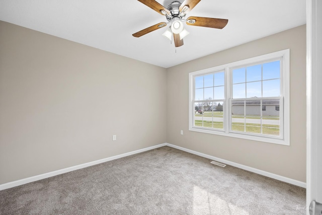 carpeted empty room with ceiling fan