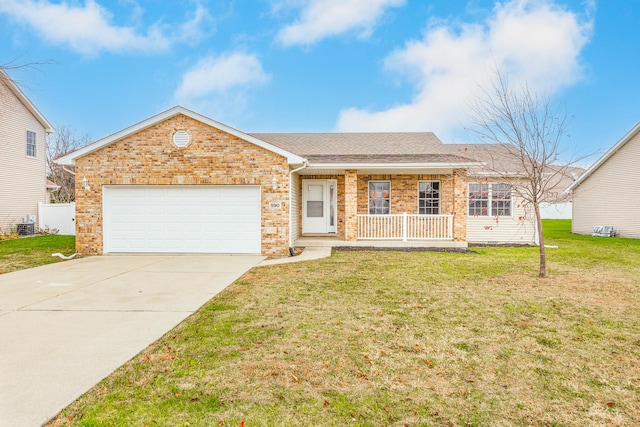 ranch-style home featuring a front lawn, a porch, and a garage